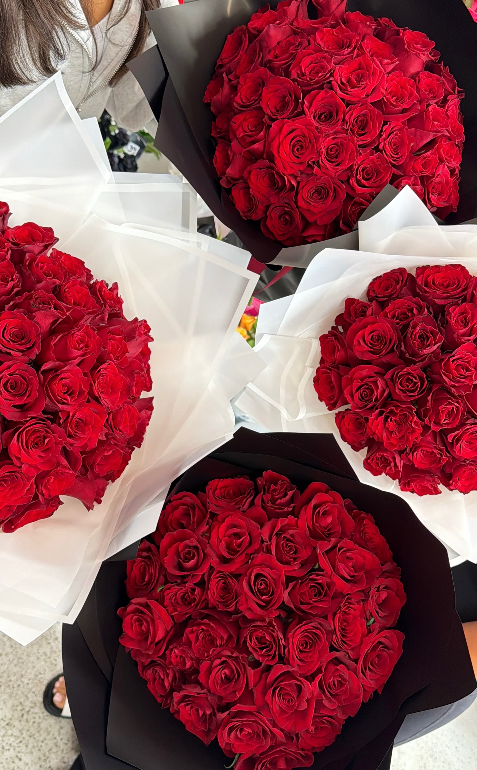 Red rose dome bouquets wrapped in black and white paper
