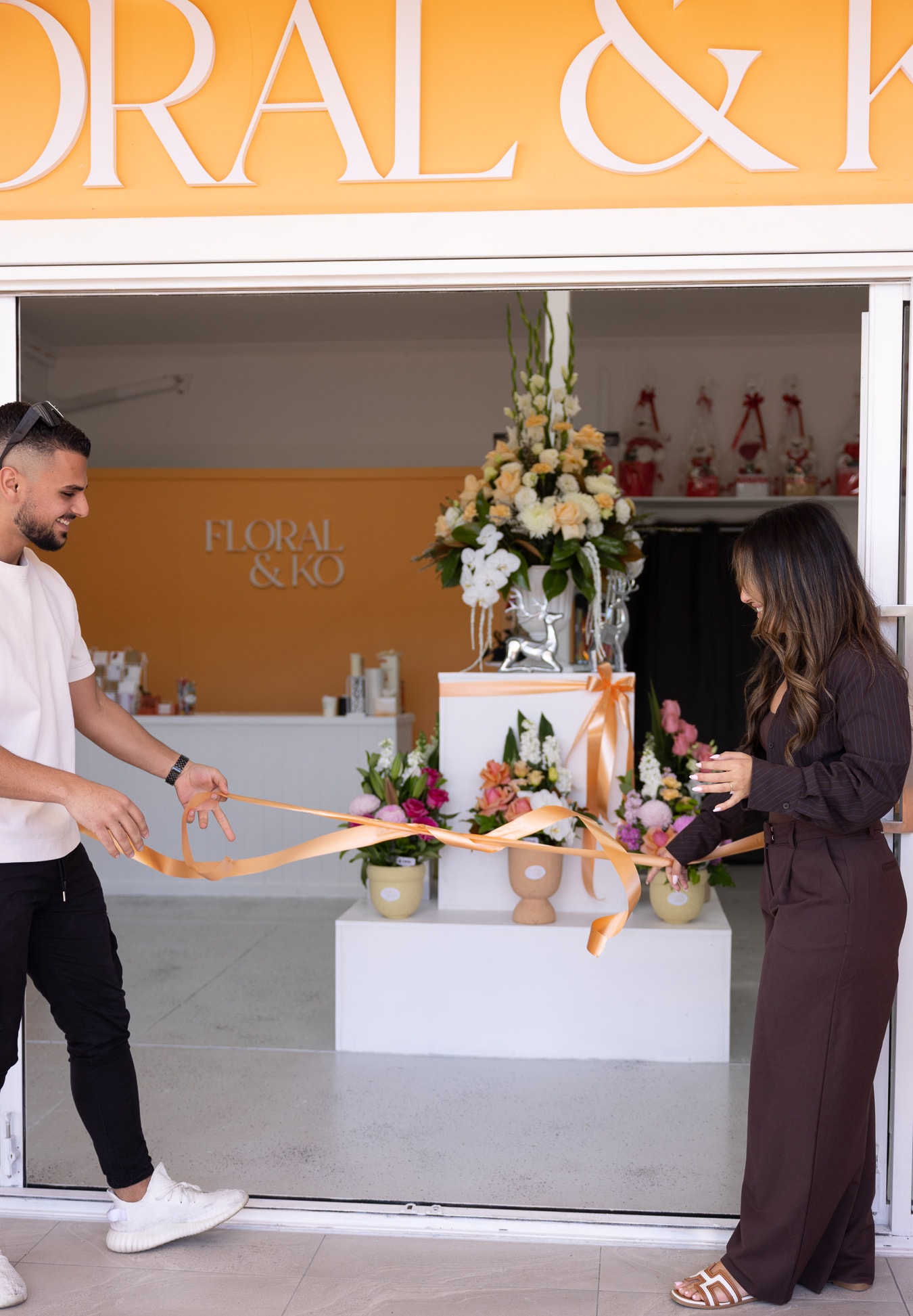 Cutting the ribbon across the Floral & Ko shopfront on opening day